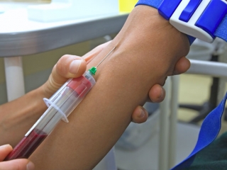 Doctor collecting blood sample